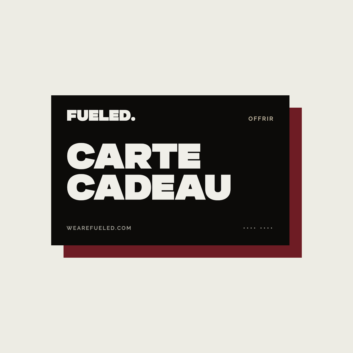 Carte cadeau FUELED, carte noire au logo FUELED sur fond papier
